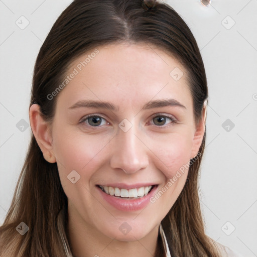 Joyful white young-adult female with long  brown hair and grey eyes