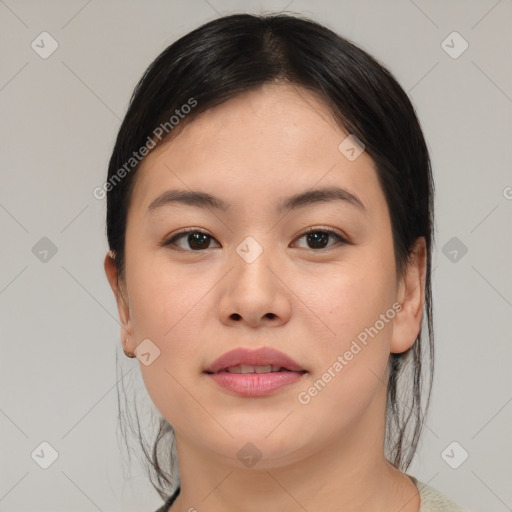 Joyful asian young-adult female with medium  brown hair and brown eyes