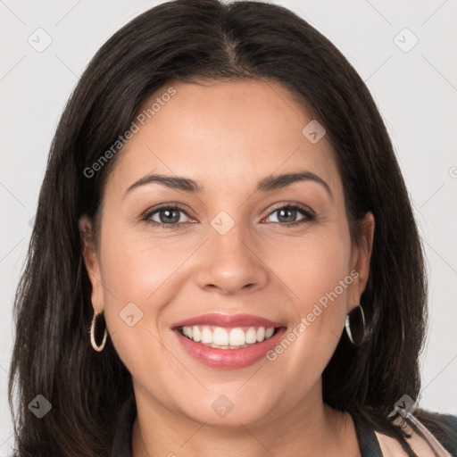 Joyful white young-adult female with long  brown hair and brown eyes