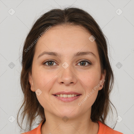 Joyful white young-adult female with medium  brown hair and brown eyes