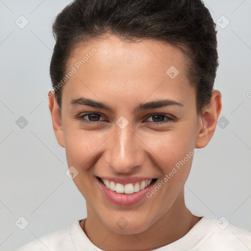 Joyful white young-adult female with short  brown hair and brown eyes