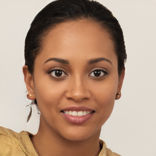 Joyful latino young-adult female with long  brown hair and brown eyes