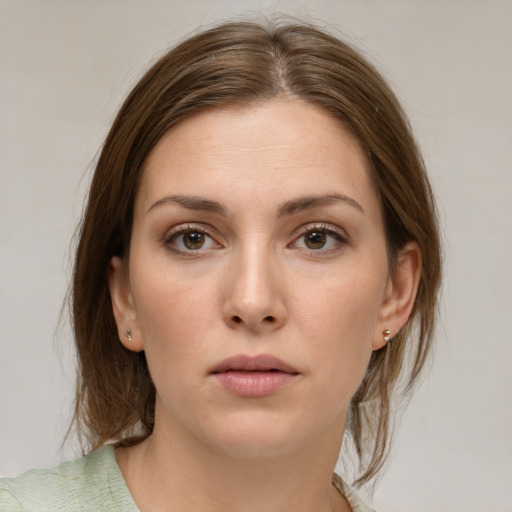 Neutral white young-adult female with medium  brown hair and brown eyes