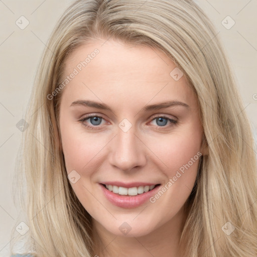 Joyful white young-adult female with long  brown hair and blue eyes