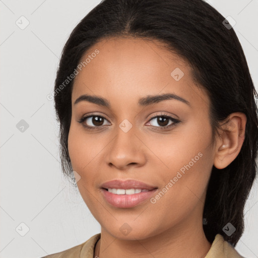 Joyful latino young-adult female with long  black hair and brown eyes