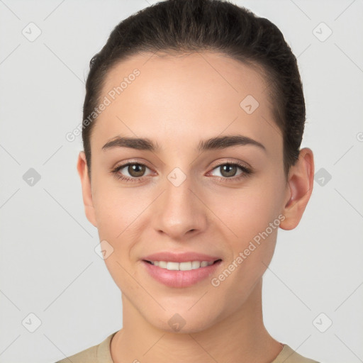 Joyful white young-adult female with short  brown hair and brown eyes