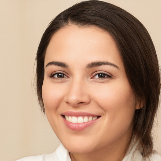 Joyful white young-adult female with medium  brown hair and brown eyes