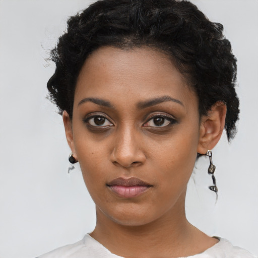 Neutral black young-adult female with short  black hair and brown eyes