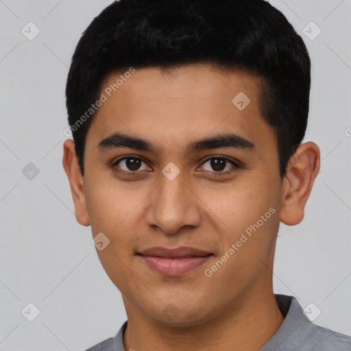 Joyful latino young-adult male with short  black hair and brown eyes