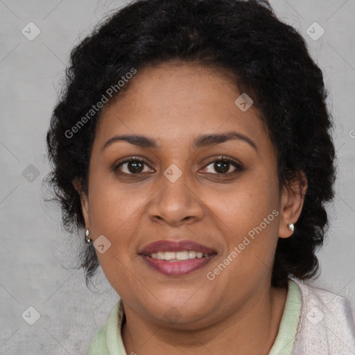 Joyful black adult female with medium  brown hair and brown eyes