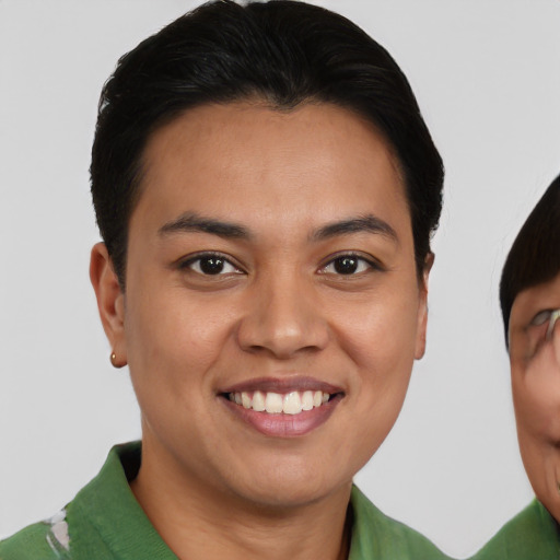 Joyful asian young-adult female with short  brown hair and brown eyes