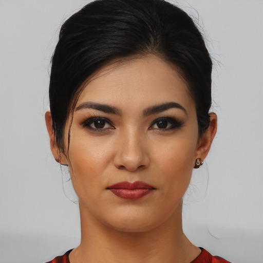 Joyful white young-adult female with medium  black hair and brown eyes
