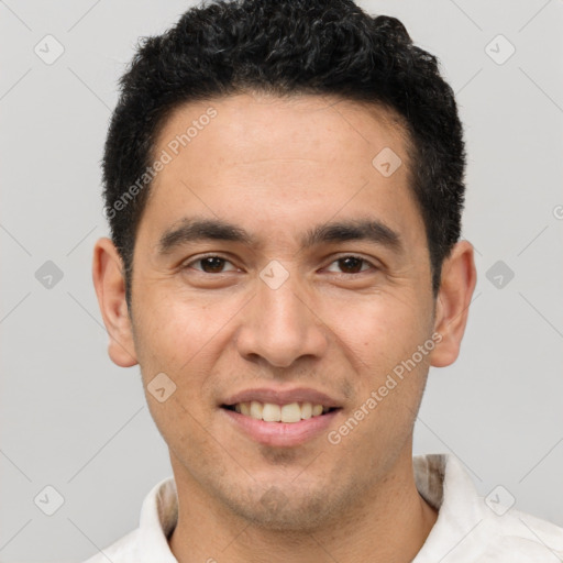 Joyful white young-adult male with short  black hair and brown eyes