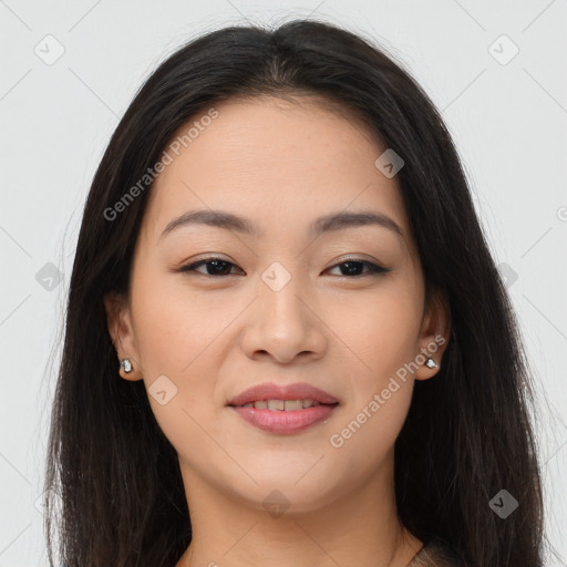 Joyful asian young-adult female with long  brown hair and brown eyes