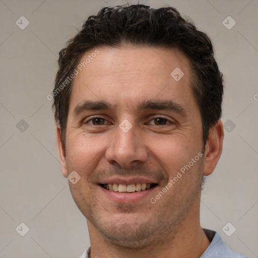 Joyful white adult male with short  brown hair and brown eyes