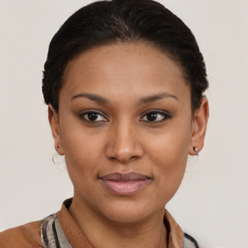 Joyful black young-adult female with short  brown hair and brown eyes