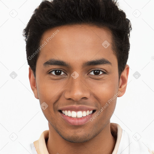 Joyful latino young-adult male with short  brown hair and brown eyes