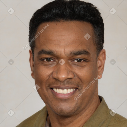 Joyful latino adult male with short  black hair and brown eyes
