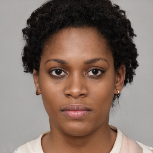 Neutral black young-adult female with short  black hair and brown eyes