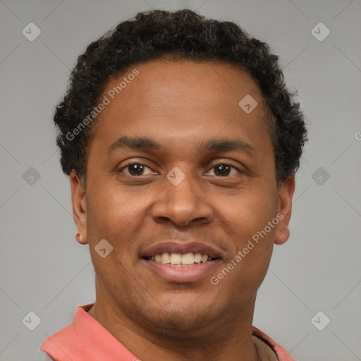 Joyful latino young-adult male with short  brown hair and brown eyes