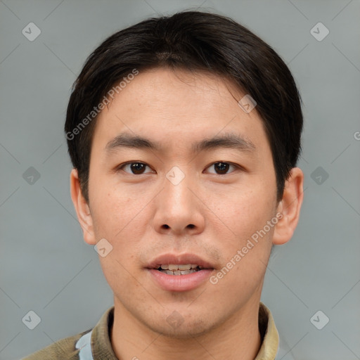 Joyful asian young-adult male with short  brown hair and brown eyes