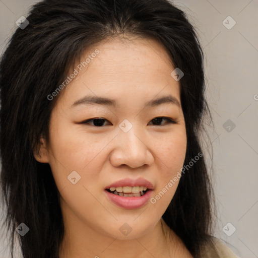 Joyful asian young-adult female with long  brown hair and brown eyes