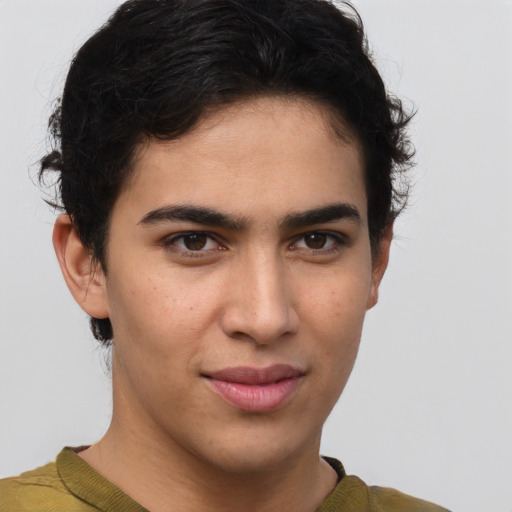 Joyful latino young-adult male with short  brown hair and brown eyes