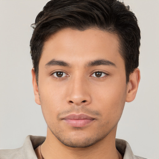 Neutral latino young-adult male with short  brown hair and brown eyes