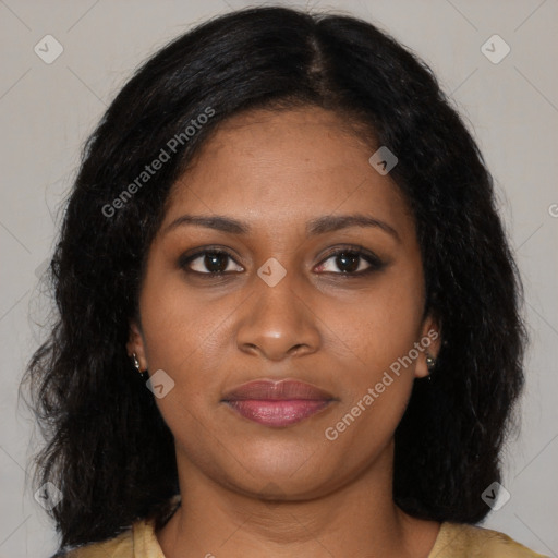 Joyful black young-adult female with long  brown hair and brown eyes