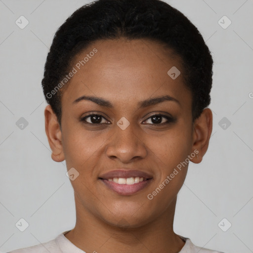 Joyful black young-adult female with short  black hair and brown eyes