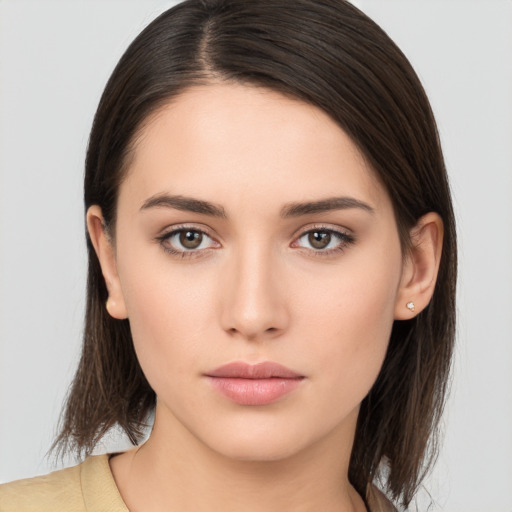 Neutral white young-adult female with medium  brown hair and brown eyes