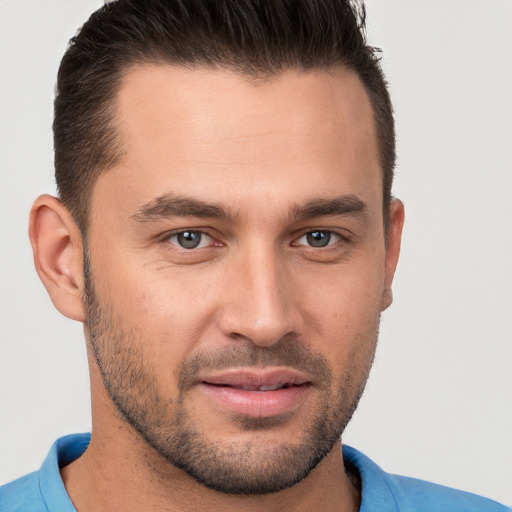 Joyful white young-adult male with short  brown hair and brown eyes