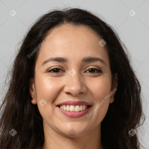 Joyful white adult female with long  brown hair and brown eyes