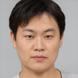 Neutral asian young-adult male with short  brown hair and brown eyes