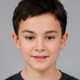 Joyful white child male with short  brown hair and brown eyes