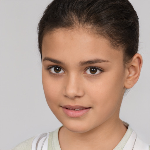 Joyful white child female with short  brown hair and brown eyes