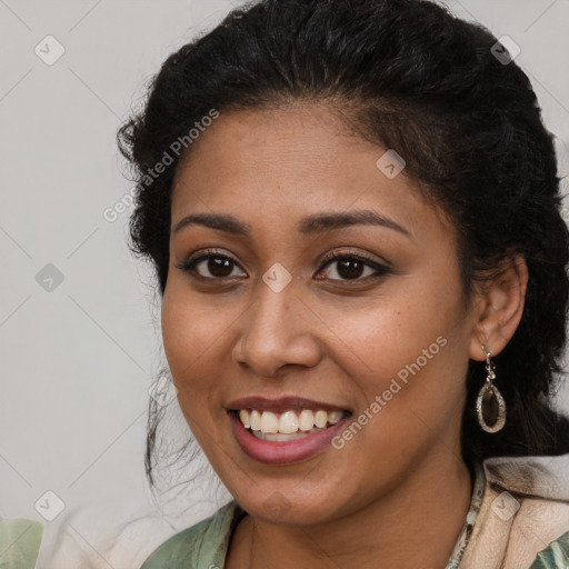 Joyful latino young-adult female with long  brown hair and brown eyes