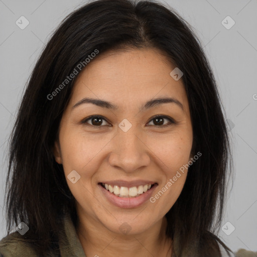 Joyful latino young-adult female with long  brown hair and brown eyes