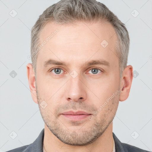 Neutral white adult male with short  brown hair and grey eyes