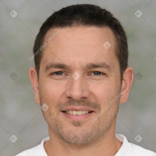 Joyful white adult male with short  brown hair and brown eyes