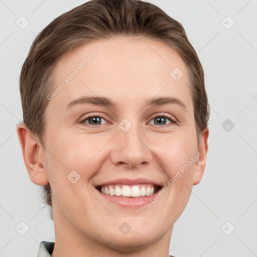 Joyful white young-adult female with short  brown hair and grey eyes