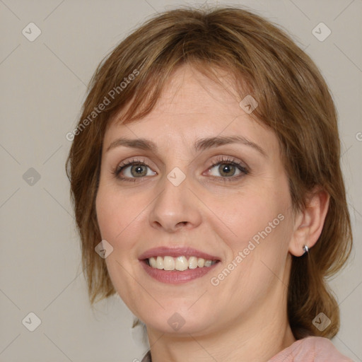 Joyful white young-adult female with medium  brown hair and green eyes