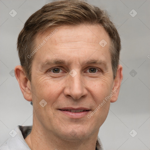 Joyful white adult male with short  brown hair and grey eyes