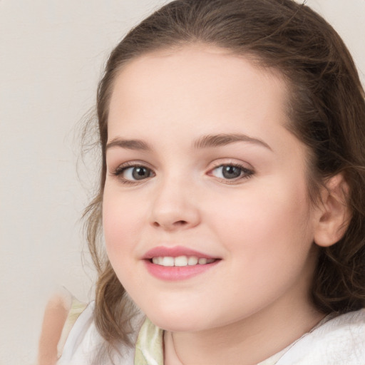 Joyful white child female with medium  brown hair and brown eyes