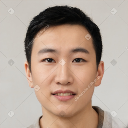 Joyful asian young-adult male with short  black hair and brown eyes