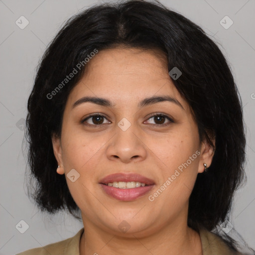 Joyful latino young-adult female with medium  brown hair and brown eyes