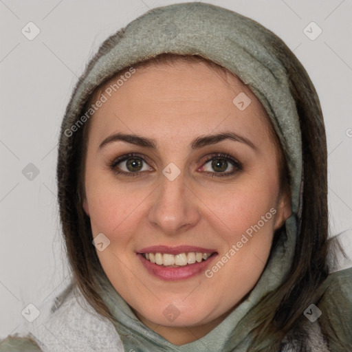 Joyful white young-adult female with medium  brown hair and blue eyes