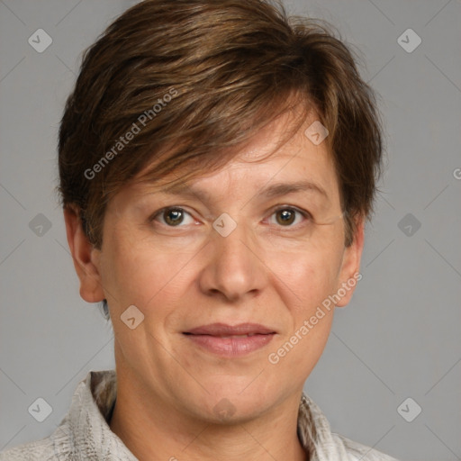 Joyful white adult female with short  brown hair and grey eyes