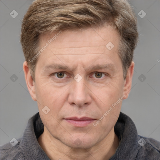 Joyful white adult male with short  brown hair and grey eyes