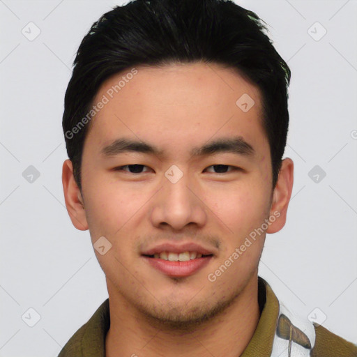 Joyful asian young-adult male with short  black hair and brown eyes